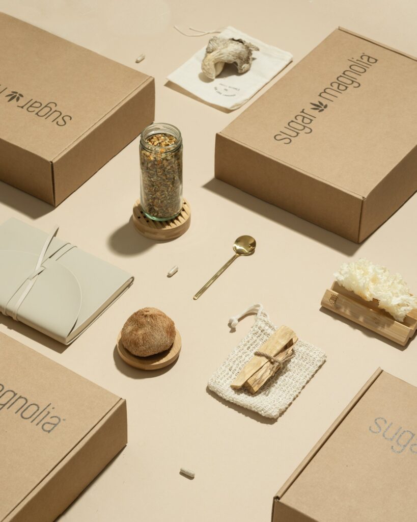 Sugar Magnolia boxes with ritual elements, including tea, a spoon, Palo Santo, mushroom gummies, and mushroom capsules | The Sacred Art of Daily Rituals | Sugar Magnolia